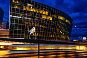 Illuminated Tram Station and a Modern Office Building in Circle in Zurich Airport at Dusk in Kloten, Zurich, Zurich Canton, Switzerland.