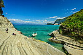  Boat anchored in natural harbor at Cape Drastis, Peroylades, Corfu, Ionian Islands, Greece 