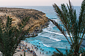 Summer beachgoers enjoy the famous Agiba 'miracle' beach cove near Marsa Matrouh on the Egyptian North Coast