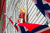  Wooden figure on one of the beautiful wooden houses in the Bryggen district, Bergen, Vestland, Norway 