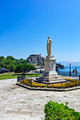  The Ioannis Kapodistias statue with the old fortress in the background, in Corfu Town, Greece 