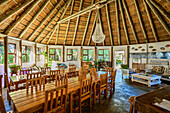  Dining room of Lambazi Lodge in a traditional rondavel, Lambazi Bay, Wild Coast Trail, Wild Coast, Eastern Cape, South Africa 