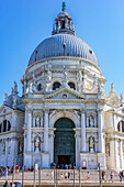  View of the Basilica Santa Maria della Salute and house facades from a boat on the Grand Canal in Venice, Italy 