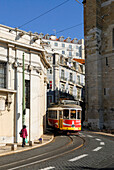 Tramway n°12 in front of the Cathedral of St. Mary Major in Alfama district, Lisbon, Portugal, Europe