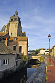 Le roulebois River bank ( tributary of Eure River) with the clock tower of the church Saint-Sulpice, Nogent-le-Roi,  Eure-et-Loir department , Centre-Val de Loire region, France, Europe