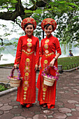 Women dressed with traditional costume, Hoen Kiem lake, Hanoi, Northern Vietnam, Southeast Asia