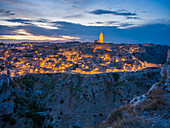  View across the gorge to the old town of Matera at night, Matera, Basilicata, Southern Italy, Italy, Southern Europe, Europe 