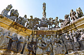  Calvary with Passion scenes &quot;The Last Supper&quot; and &quot;Carrying of the Cross&quot; in the parish enclosure in Guimiliau, Finistere, Brittany, France 