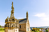  Parish enclosure with Calvary and rich figural decoration in Plougonven, Cote du Leon, Finistere, Brittany, France 