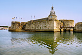  Ville Close with clock tower at the entrance to the fortifications and Tour Major in Concarneau, Cornouaille, Finistere, Brittany, France 