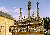  Calvaire (Calvary) and Chapelle Notre-Dame de Tronoen in Saint-Jean-Trolimon, Cornouaille, Finistere, Brittany, France 