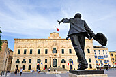 Bronze statue of Manwel Dimech (1860-1921) in front of the Auberge de Castille, Castille Square, Valletta, Malta, Southern Europe