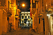 Nestu Laiviera Street toward the statue of St. Lawrence in front of the BeBirgu Cafe & Brasserie in the unique setting of the historical San Lawrenz Band Club Palazzo at the Victory Square (Misrah ir-Rebha) of Birgu Vittoriosa,Three Cities, Malta, Southern Europe