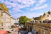 View from the city wall onto Rue Jacques Cartier with restaurants and cafés Intra Muros on the fortified island of Ville Close in Saint-Malo, Côte d'Emeraude, Côtes-d'Armor, Brittany, France
