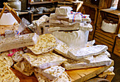  Display table with slices of white nougat in the confectionery shop Gourmandises et Traditions on Place du Puits in Rochefort-en-Terre, Morbihan, Brittany, France 