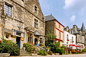  Place du Puits with slate and granite houses and a half-timbered house in Rochefort-en-Terre, Morbihan, Brittany, France 