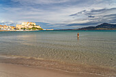  The beach and town view with marina and citadel in Calvi, Balagne, Corsica, France 