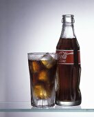 A Cold Glass of Coca Cola with the Bottle