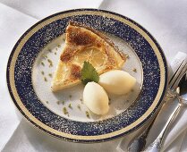 A piece of lemon tart with lemon ice cream