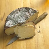 Pecorino Cheese Partially Sliced; Knife