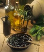 Olive Oil with Big Bowl of Black Olives