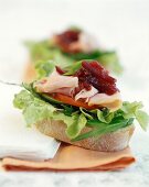 Sandwich with salad, boiled ham and beetroot relish