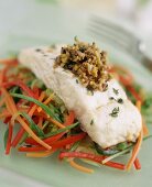 Turbot fillet with olive dressing on julienne vegetables