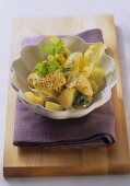 Potato salad with grape seed oil, sprouts and coriander