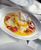 Fried pike-perch fillet on mashed potato with saffron butter