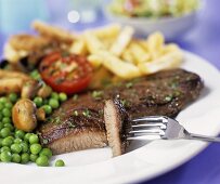 Beef steak with vegetables and chips