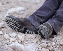 Feet of an exhausted worker on limestone soil, Coonawarra