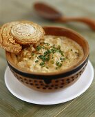 Parsnip and swede soup with almonds, pastry snail