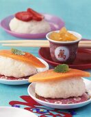 Fusion food: sweet rice sushi and candied ginger cubes