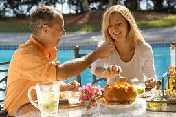 Holiday in Brazil: couple eating typical Brazilian dishes