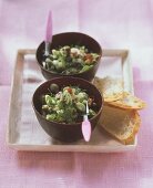 Cucumber and olive salad in two bowls