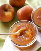 Peach jam in preserving jars
