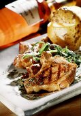 Barbecued lamb chops with herbs and baked potato