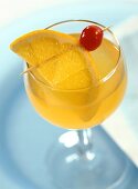 Whisky Sour in cocktail glass with slice of orange and cherry