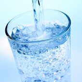 Pouring mineral water into a glass