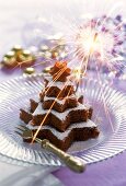 Fir tree-shaped chocolate & nut cake made from star shapes