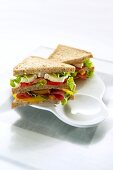 Double-decker sausage and salad sandwiches