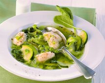 Green vegetable soup with chicken dumplings