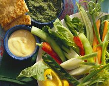 Raw vegetable salad with two dips