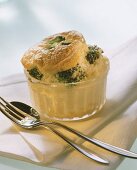 Cauliflower & broccoli souffle in glass dish; fork & spoon
