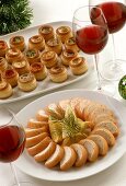 Salmon pate and puff pastry tartlets; red wine