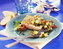 Fried pike-perch in herb marinade with diced tomatoes