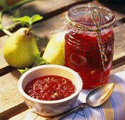 Cranberry and pear jam with cardamom in jar and dish