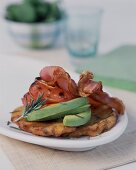 Potato cakes with avocados, tomatoes and bacon