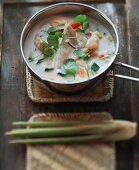 Chicken soup with coconut milk and coriander leaves