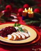 Turkey breast with red cabbage & mashed potato; fir, candles